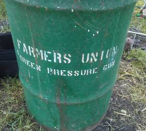 lot 373 image: Farmers Union can & rubber belting.