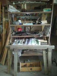 lot 422 image: Shelving unit & contents - everything pictured. Under Armor sandals, kid boots, Pakistan knife. & more big lot