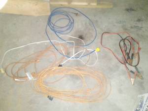 lot 453 image: 4 Extension cords and Jumper cables.
