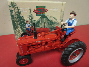 lot 903 image: VINTAGE SPECIAL 50TH ANNIVERSARY EDITION ERTL FARMHALL H TRACTOR WITH FARMER, DIE CAST METAL TOY