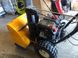 lot 49 image: Cub Cadet 24 in. 208cc 2-Stage Electric Start Gas Snow Blower With Power Steering In working condition see pics 