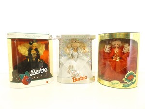 lot 37 image: 1991, 1992, and 1993 Holiday Barbies