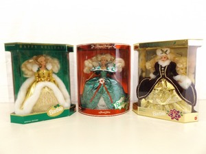 lot 38 image: 1994, 1995, and 1996 Holiday Barbies