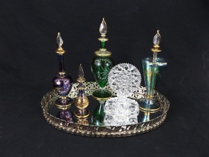 lot 74 image: Vintage Crystal etc. Perfume Bottles on a Mirrored Dresser Tray 