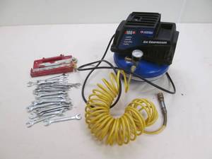 lot 12 image: Campbell Hausfeld air compressor ,tools
