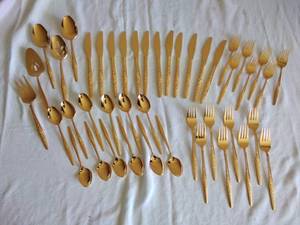 lot 101 image: 44 Pieces of Gold-tone Silverware