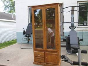 lot 1 image: Wood Locking Gun Cabinet with Keys,...