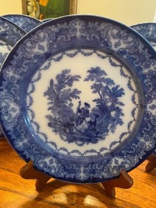 lot 119 image: Lot of Nine English Flow Blue Plates