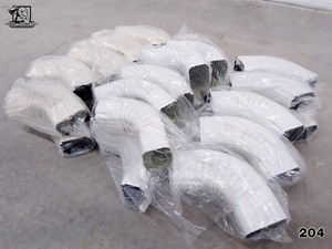 lot 204 image: Assorted Gutter Elbows 2 2x3 and 3x4 Gutter Elbows 30 pcs Norandex and EDCO