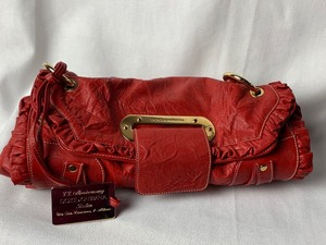 lot 5 image: Gorgeous Dolce and Gabbana Red Leather 10th Anniversary Satchel Handbag