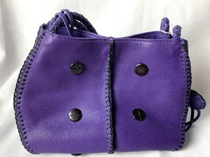 lot 11 image: Carlos Falchi Purple Leather Handbag