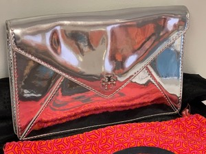 lot 23 image: Tori Burch Metallic Clutch