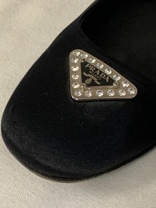 lot 24 image: Prada Shoes- Black Flats (Size 38.5)