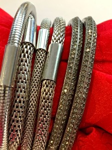lot 198 image: Six Silver-Tone Bracelets