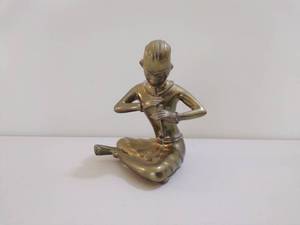 Vintage Brass Man Playing Flute