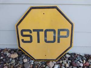 lot 60 image: Yellow Metal STOP Sign