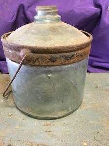 lot 18 image: The Cleveland Metal Company Glass Kerosene jug
