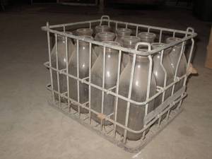 lot 52 image: Crate of vintage milk botteles...