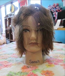 lot 102 image: Female mannequin head with hat...