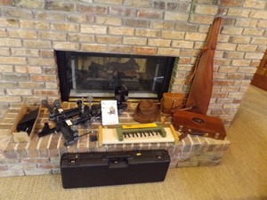 lot 12 image: Lot of Misc Hunting Leather Scabbards, Cleaning Kits, Stands, etc.