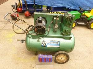 lot 11 image: Sears 2 hp horizontal air compressor. 220 volt Approx 20 gallon. Tested & works. Just taken out of shop. As shown.