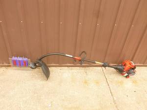 lot 12 image: Troy Bilt 2 cycle weed trimmer. Nearly new. Tested & works. As shown.