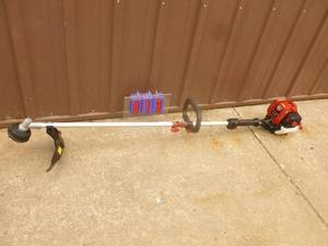 lot 13 image: Craftsman 4 cycle weed trimmer. Like new condition. Tested & works. As shown.