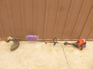 lot 14 image: Troy Bilt 2 cycle weed trimmer. Tested & works. As shown.
