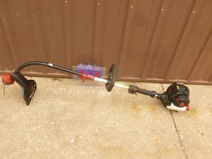 lot 15 image: Craftsman 4 cycle weed trimmer. Lightly used. Tested & works. As shown.