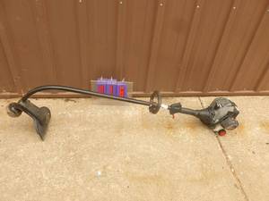 lot 16 image: Craftsman 2 cycle weed trimmer. Lightly used. Tested & works. As shown.