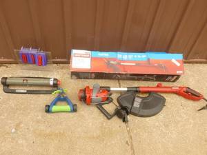 lot 18 image: Craftsman 110 volt weed trimmer with qty of 2 lawn sprinklers. Appears new. As shown.