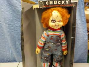 lot 32 image: Chucky Doll 26 tall box is damage...