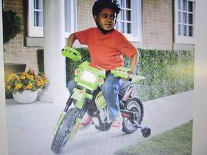 lot 64 image: Green Motorcycle open box Retail $1...