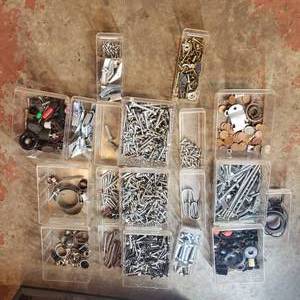 lot 34 image: hardware organizer with contents