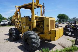 lot 9 image: 1989 Vermeer Model M495 4 x 4 Rear Mount Cable Plow