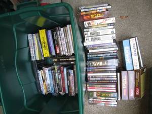 lot 86 image: 22 Gallon Tote Full of DVDs See P...