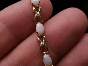 lot 13 image: Beautiful Opal and Diamond Estate Bracelet in Yellow Gold