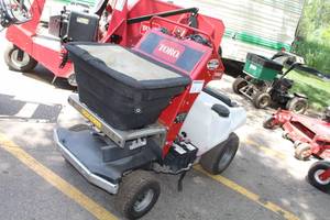 lot 13 image: Toro Stand-On SpreaderSprayer 34215