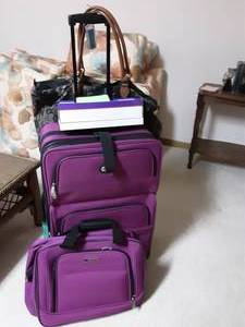 lot 140 image: Plum Purple Luggage