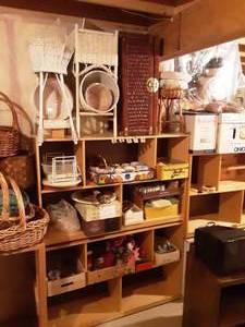 lot 189 image: Large Lot Wicker Chest With Shelves White Wicker, Boxes With House Hold Misc.,Coffee Cups, Candles, More