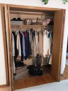 lot 207 image: Contents Of Closet With Womens Coats, Boots, Gloves, Scarves, Purses, Eureka Upright Vacuum