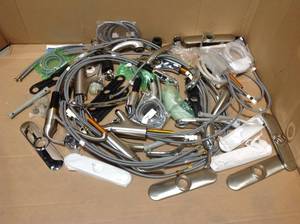 lot 100 image: Assorted pieces and parts of branded Faucets