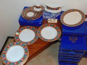 lot 25 image: Faberg Karsavina pattern tableware  120 piece white, red and multicolor fine china set with gilt accents, geometric motifs and brand stamp at undersides Mint condition original boxes