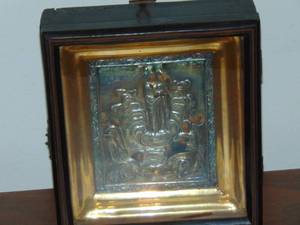lot 222 image: Russian icon with traveling case hand hammered silver over original painting