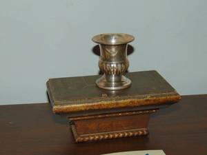 lot 386 image: Wall shelf with small silver cup on it