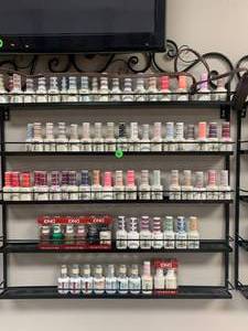 lot 101 image: Lot of 80 DND Soak Off Gel Nail Polish & Rack ($9 to $12 each on Amazon)