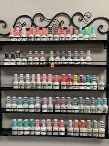 lot 100 image: Lot of 75 DND Soak Off Gel Nail Polish & Rack ($9 to $12 each on Amazon)
