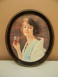 lot 47 image: VINTAGE 1973 COCA-COLA METAL SERVING TRAY - IMAGE FROM 1923 ADVERTISEMENT, OVAL - SEE PICTURES