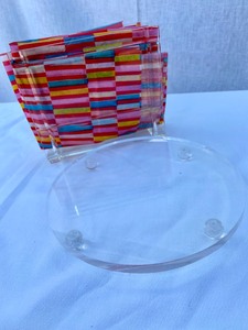lot 15 image: Pair-Lucite Napkin Holder & Round Trivet