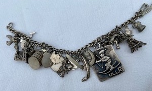 lot 31 image: Vintage Sterling Silver Charm Bracelet w 33 Charms